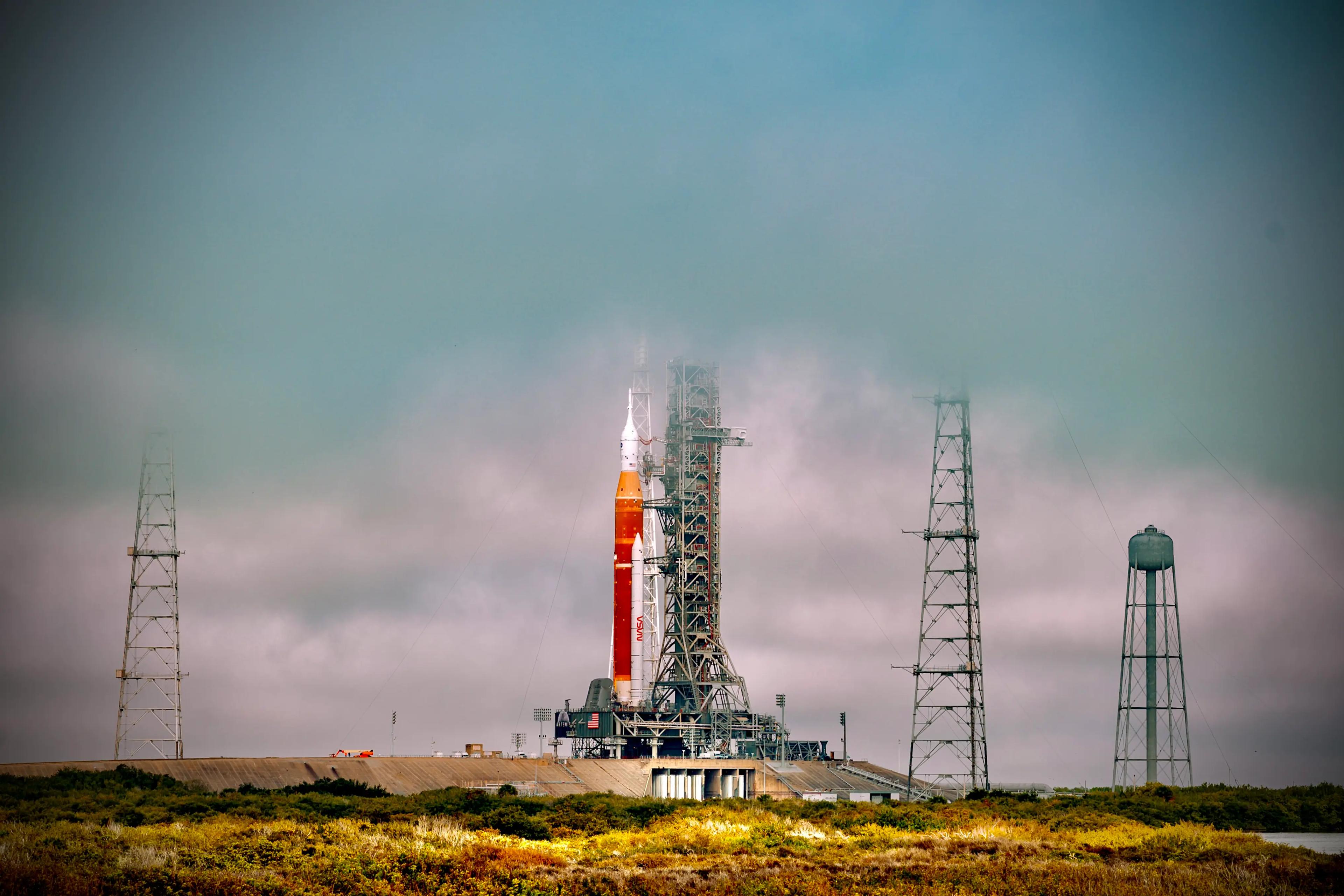 Foggy view of a rocket ready to take off from launch tower